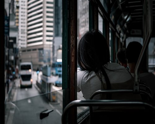 A quiet moment on a city tram looking out the window
